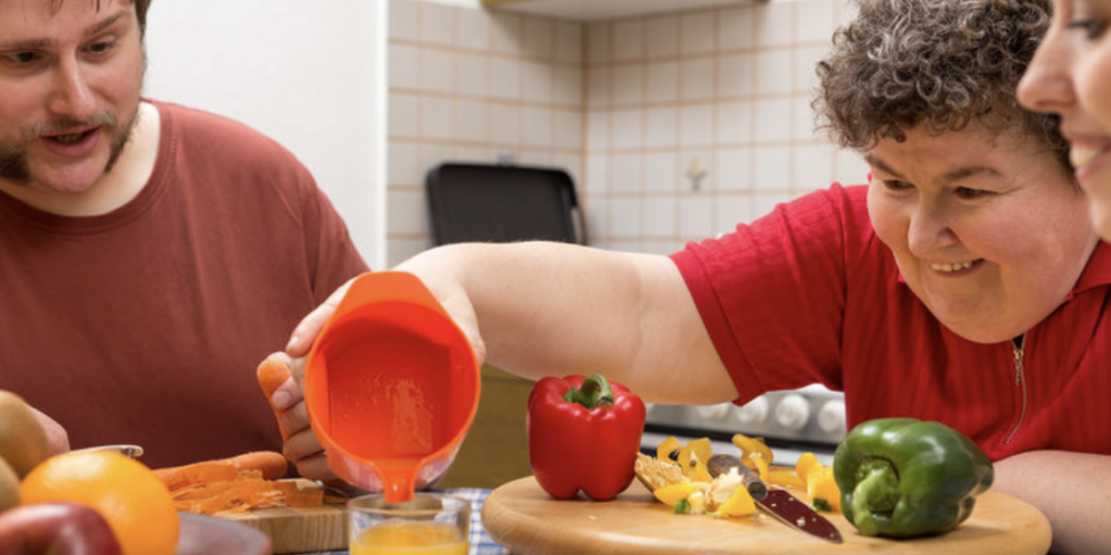 adult with intellectual disability cooking with parents who have guardianship