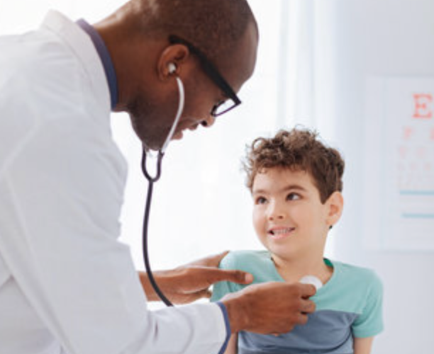 A school age boy with a congenital heart defect and developmental disability at the doctor